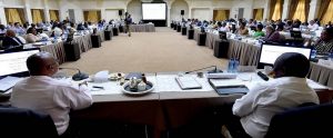 large group of people in a conference room talking