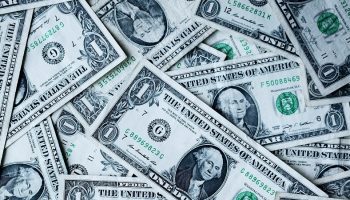 American one dollar bills piled on each other