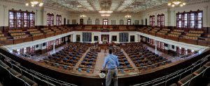 man looking down up a US legislature chamber