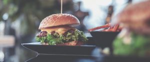 burger on a plate outside