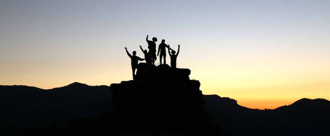 team on a hill