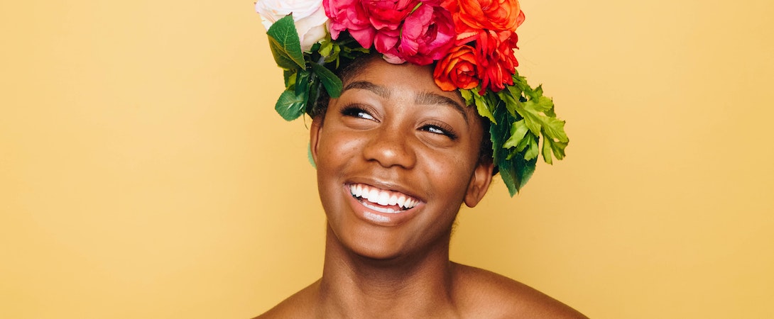 black woman flower hat