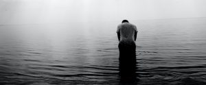 sad man in water
