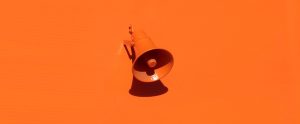 orange megaphone on orange background