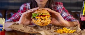 holding a burger