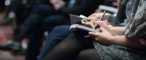 Student taking notes in a notebook