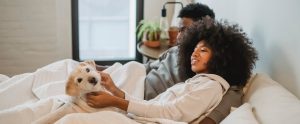 couple-lounging-with-dog