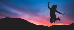 person-jumping-at-sunset
