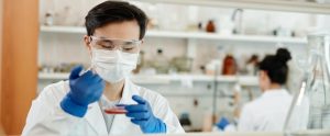 scientist-looking-at-petri-dish