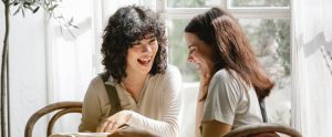two-women-laughing-together