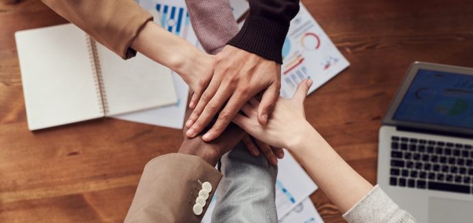 teamwork-hands-in-a-circle