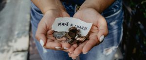 Hands holding money and make a change sign