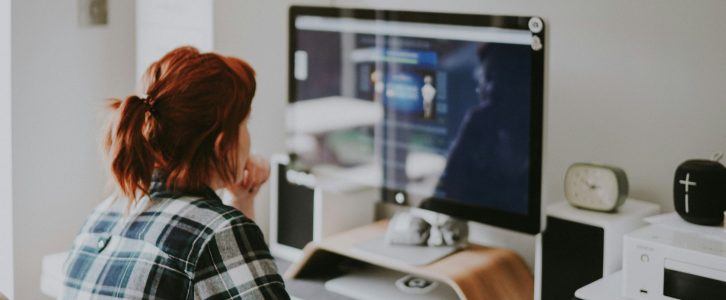 person looking at blurred computer screen