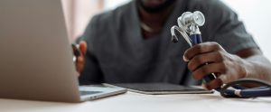 close-up of hand holding stethoscope