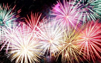 colorful fireworks exploding in night sky