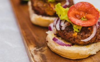 open-faced vegan burger on wooden board