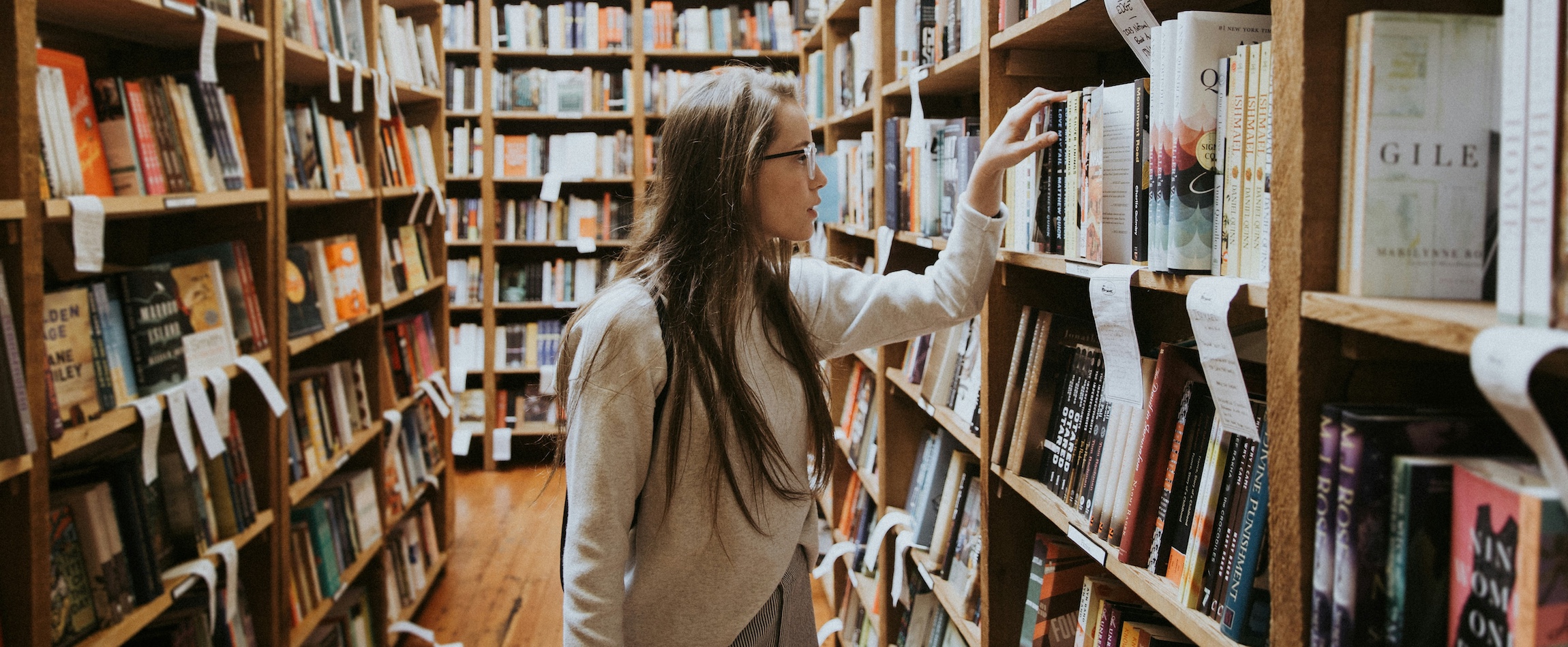 woman browsing bookshelves