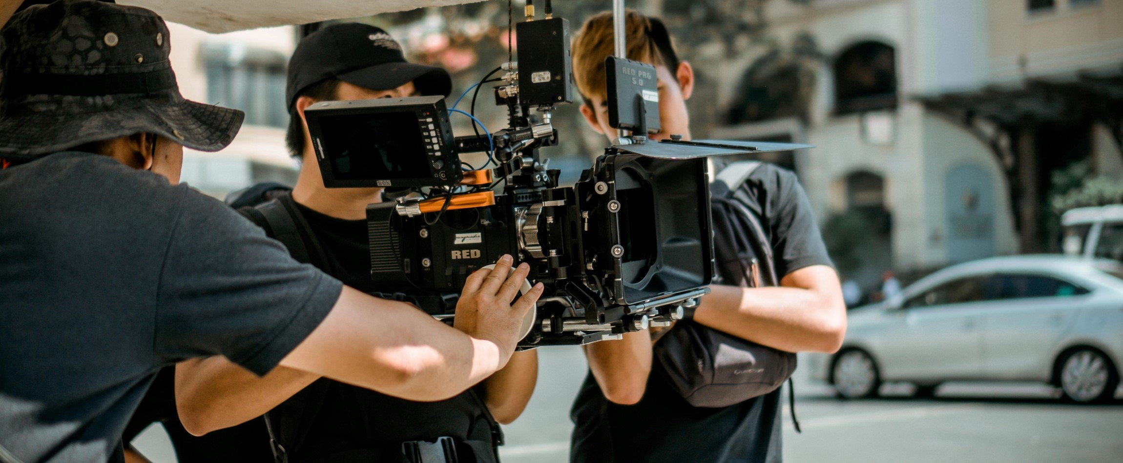 person holding camera movie set