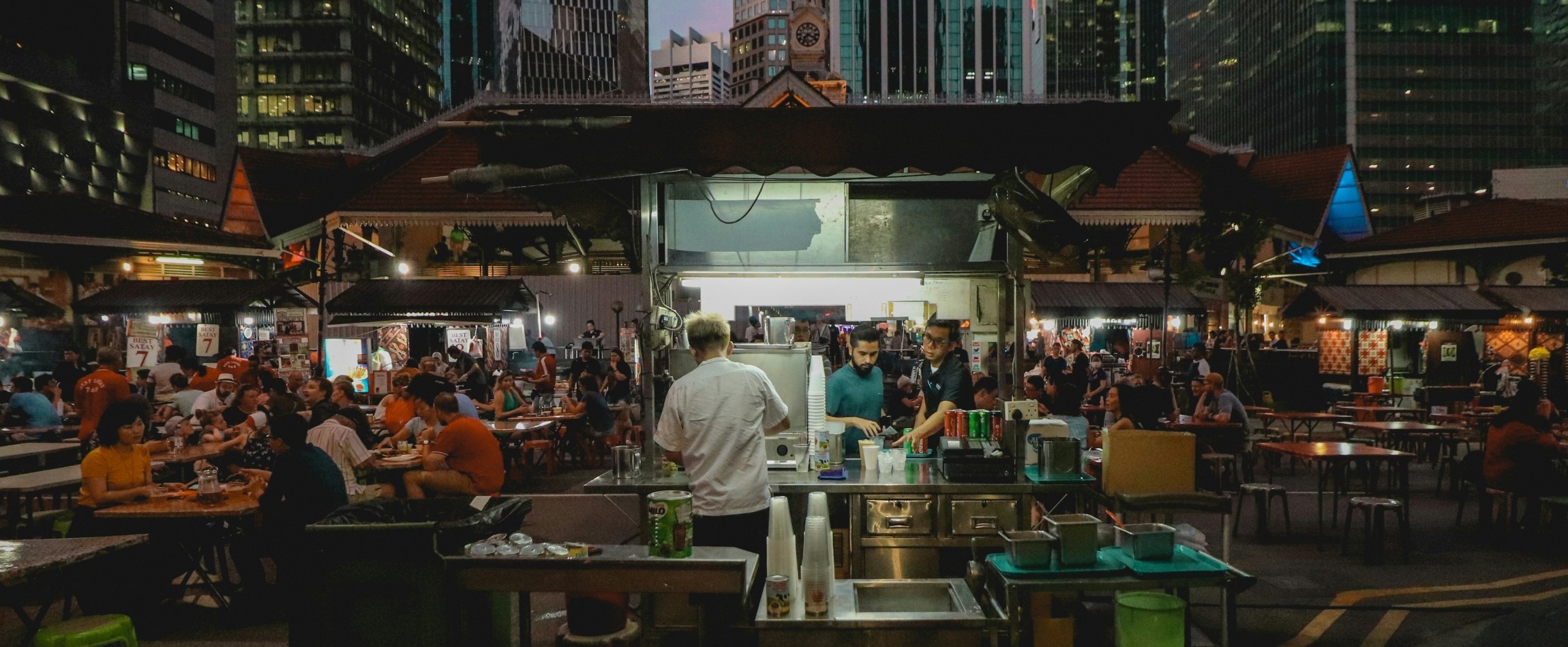 people eating in hawker center Singapore