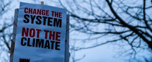 climate change protest sign change the system not the climate
