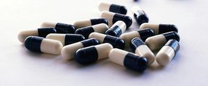 blue-and-white capsules medication antibiotics