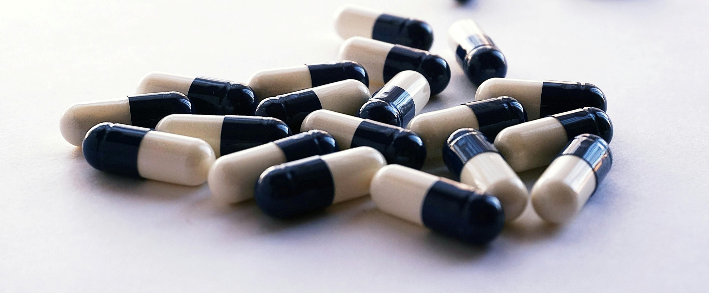 blue-and-white capsules medication antibiotics