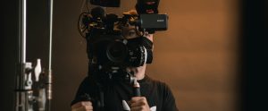 person with movie camera