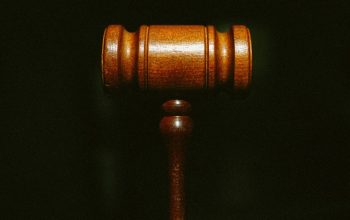 close-up of wooden gavel dark background