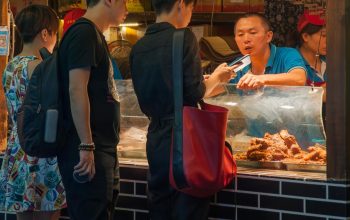 people at night market food stall China