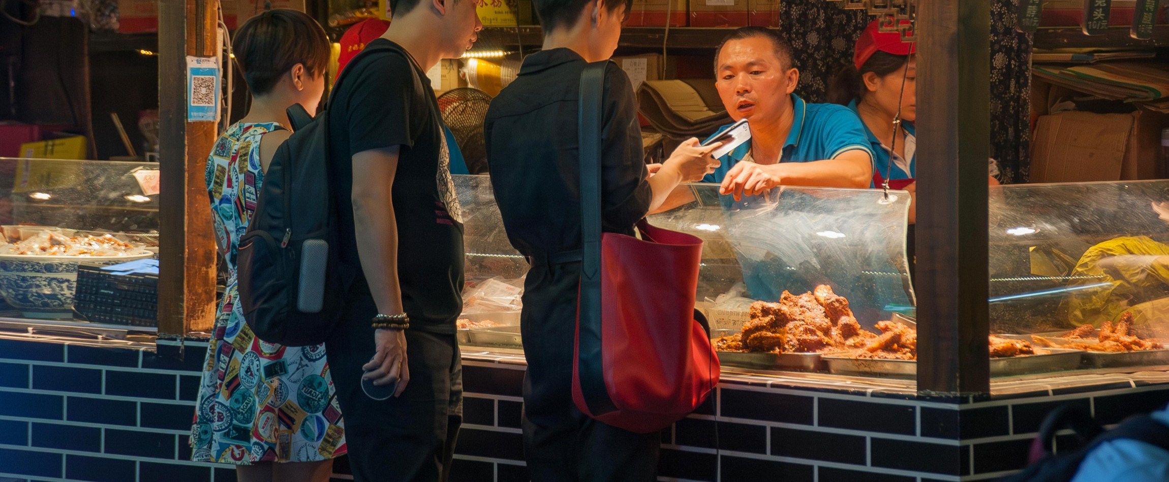 people at night market food stall China