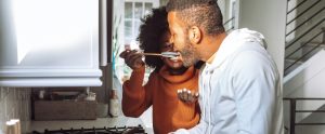 two people cooking together