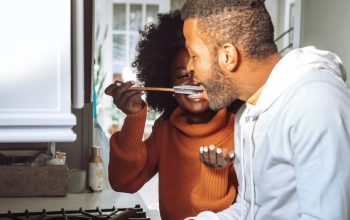 two people cooking together
