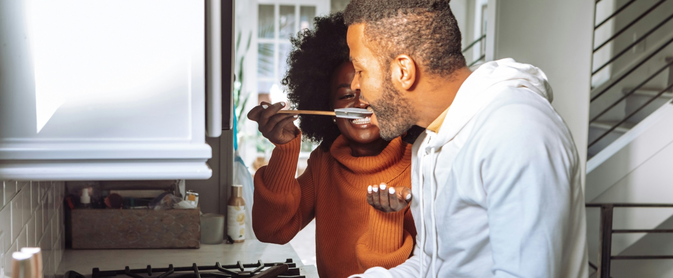 two people cooking together