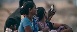 family sitting together on beach Puducherry India