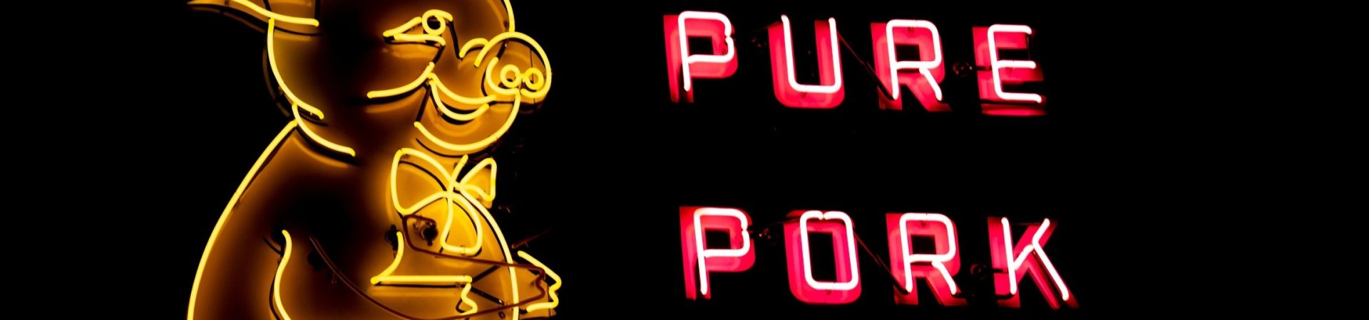 neon sign with cartoon pig pure pork sausage