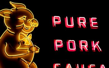 neon sign with cartoon pig pure pork sausage