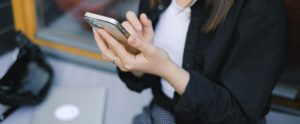 close-up of hands holding phone