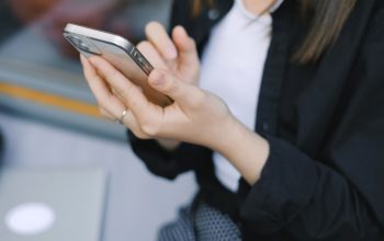 close-up of hands holding phone