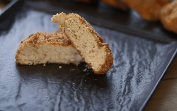 close-up of breaded vegan chicken nugget on black plate