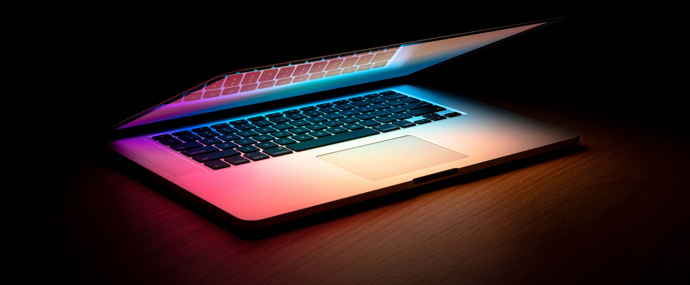 open laptop dark desk